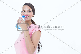 Happy woman drinking bottle of water