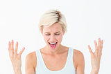 Angry blonde yelling with hands up