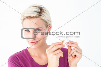 Pretty blonde breaking cigarette