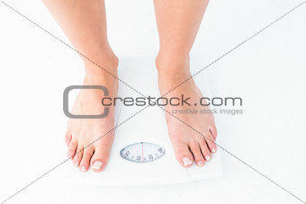 Woman standing on the scales