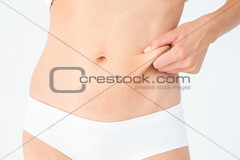 Woman posing without any fat on her belly