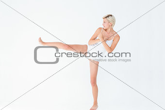 Pretty woman raising her leg
