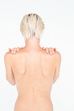 Beautiful topless woman touching her shoulders