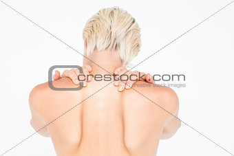 Beautiful topless woman touching her neck