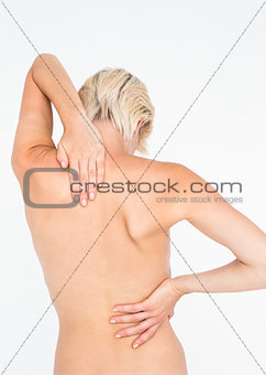 Pretty woman suffering from back pain