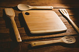 Chopping board with wooden utensils