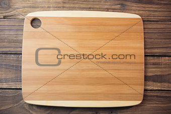 Chopping board on wooden table