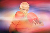 Composite image of close-up portrait of a determined senior boxer