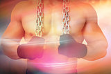 Composite image of mid section of a shirtless muscular man holding chain