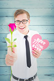 Composite image of geeky hipster holding a red rose and heart card