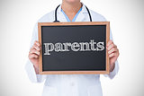 Parents against doctor showing little blackboard