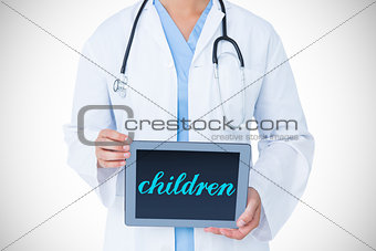 Children against doctor showing tablet pc