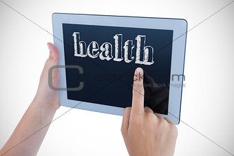 Health against woman using tablet pc