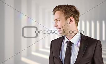 Composite image of young handsome businessman looking away