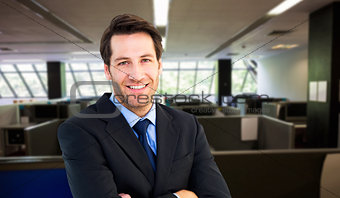 Composite image of smiling businessman with arms crossed