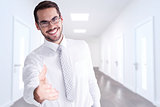 Composite image of happy businessman with glasses offering handshake