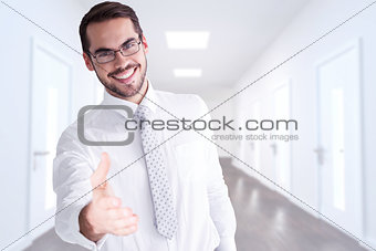 Composite image of happy businessman with glasses offering handshake
