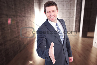 Composite image of businessman smiling and offering his hand