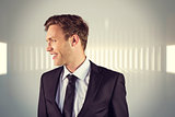 Composite image of young handsome businessman looking away