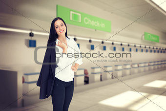 Composite image of pretty businesswoman smiling at camera