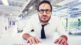 Composite image of business worker with reading glasses on computer