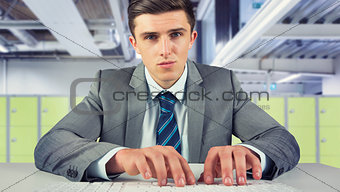 Composite image of serious businessman