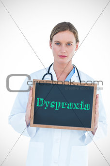 Dyspraxia against doctor showing chalkboard