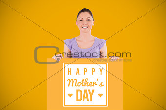 Composite image of portrait of a charming woman posing behind a billboard while standing