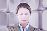 Composite image of businesswoman looking at the camera