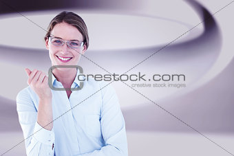 Composite image of smiling businesswoman looking at camera