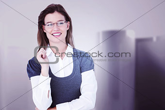 Composite image of smiling woman looking at camera