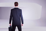 Composite image of rear view businessman standing with his briefcase