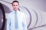 Composite image of cheerful businessman posing with hands in pockets