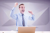 Composite image of businessman cheering