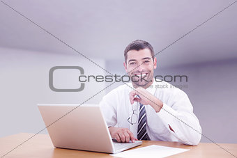 Composite image of businessman smiling