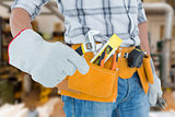 Composite image of technician using adjustable wrench against white background