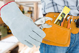 Composite image of technician using pliers over white background