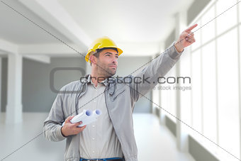 Composite image of architect pointing