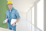 Composite image of happy carpenter holding rolled blueprint and clipboard