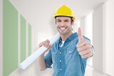 Composite image of architect holding blueprint while gesturing thumbs up