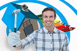 Composite image of happy handyman holding hammer