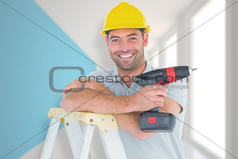 Composite image of male technician holding power drill on ladder