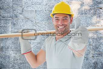 Composite image of worker with plank of wood