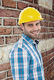 Composite image of confident repairman wearing hard hat