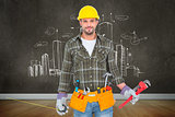 Composite image of manual worker holding various tools