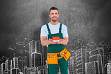 Composite image of happy construction worker holding house model
