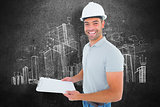 Composite image of portrait of manual worker holding clipboard