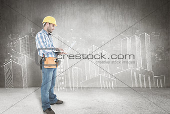 Composite image of full length of repairman using laptop