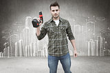 Composite image of worker holding drill