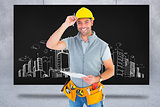 Composite image of portrait of smiling manual worker holding clipboard